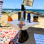 Portable table with drinks on a beach setting